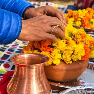 Asthi Visarjan in Varanasi (Kashi) showing a client putting garland on asthi kalash