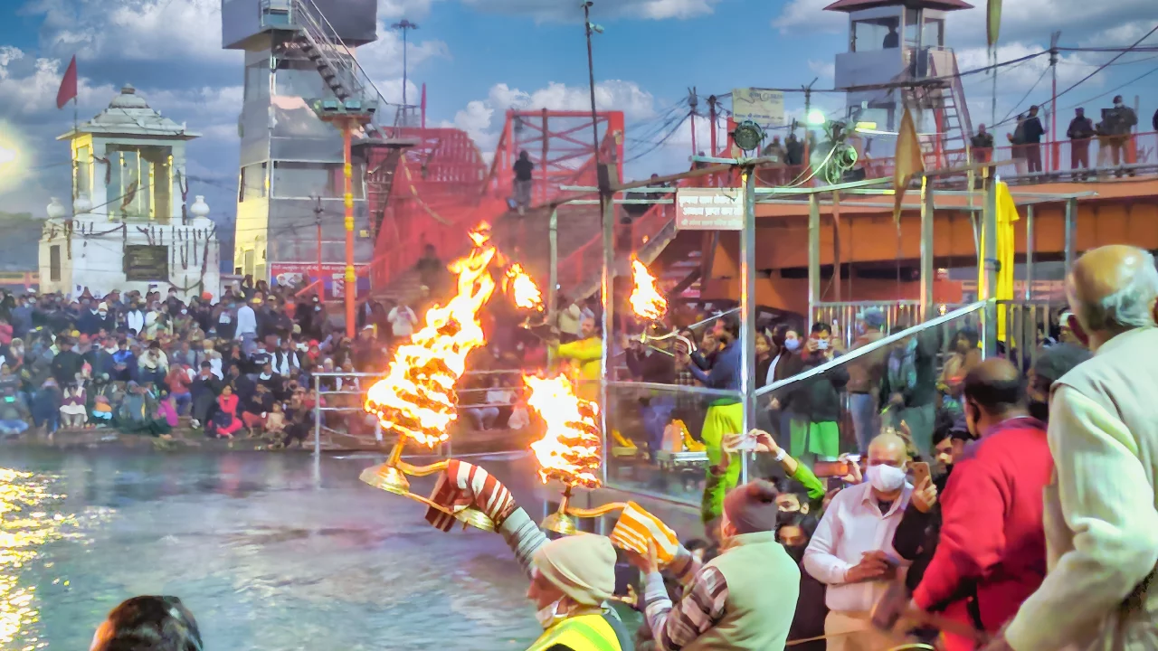 Lamp donation ceremony at a sacred riverbank during Kartik