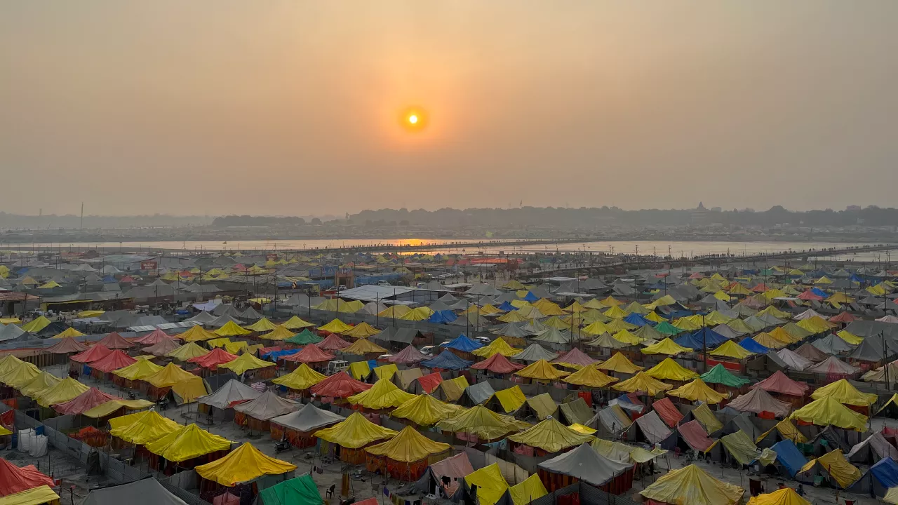 Devotees performing tarpan offerings during Pitrupaksha 2026 at a sacred river ghat