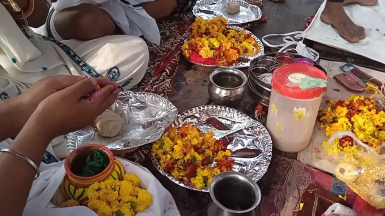 Image of a person doing rituals for their ansesters- Varanasi pilgrimage from Malaysia